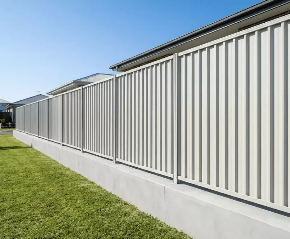 A Colorbond steel fence running along a residential boundary in Newcastle.